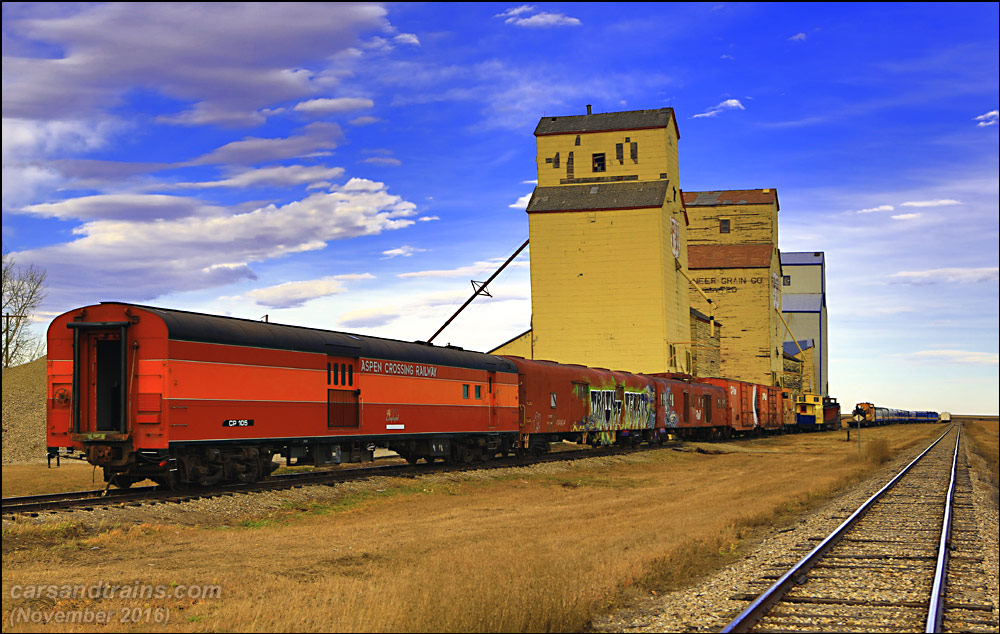 Old trains and grain elevators at Mossleigh, Alberta.